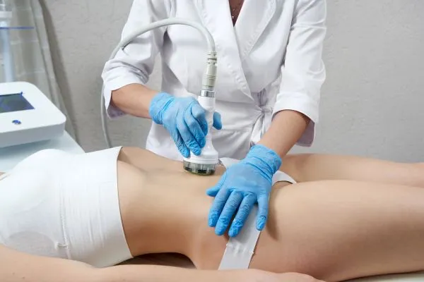 Lost the Weight but Not the Loose Skin? 2 woman having HIFU treatment on her stomach to combat loose skin Epping Green following weight loss